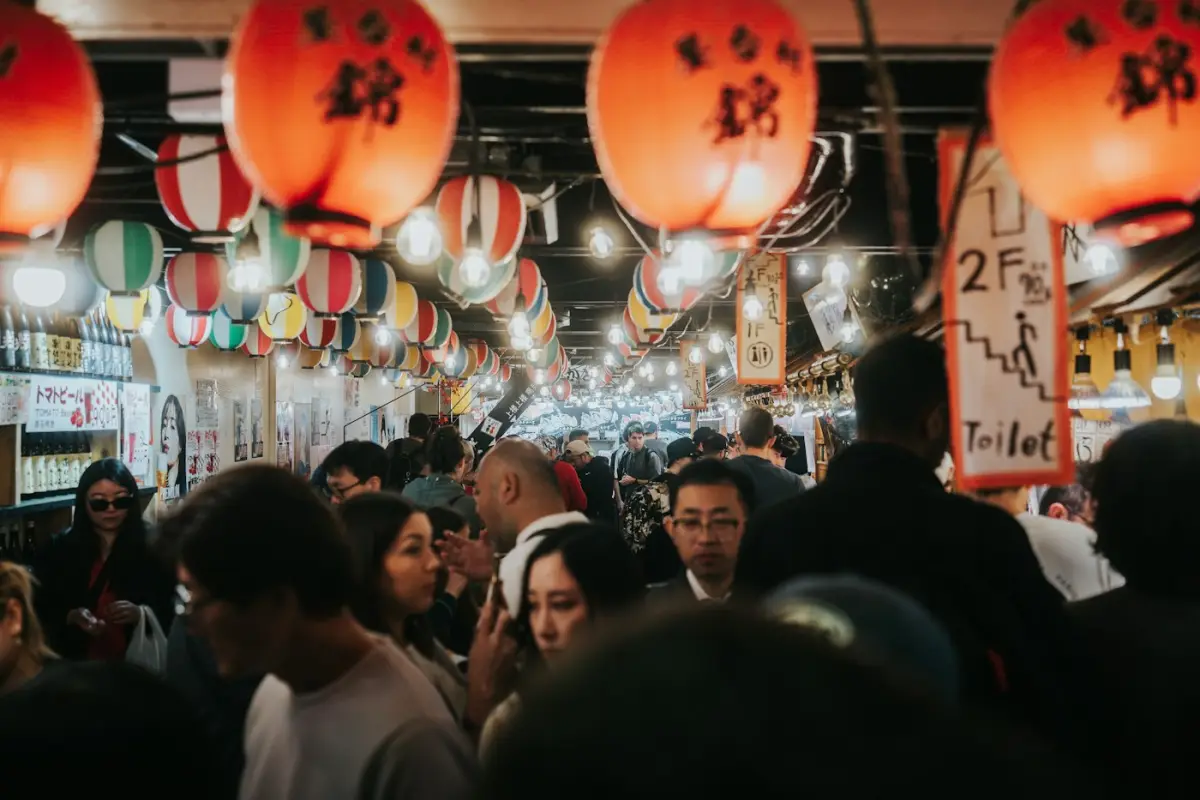 Shoppers walking through a covered market in Downtown Kyoto